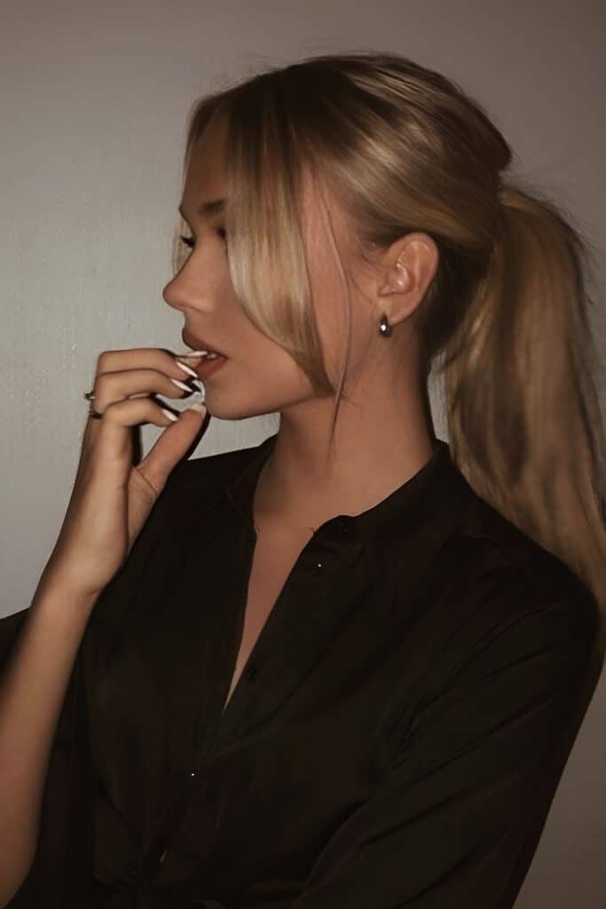 Clean Blonde Ponytail with Curtain Bangs for Work