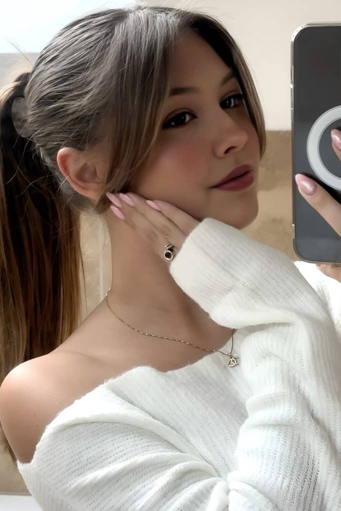 Mid Level Ponytail with Center Part Curtain Bangs