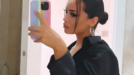 Low Slick Bun with Clean Parting and Polished Shine