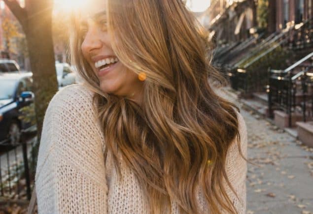 Low maintenance fall hair colors caramel bronde balayage in golden autumn light