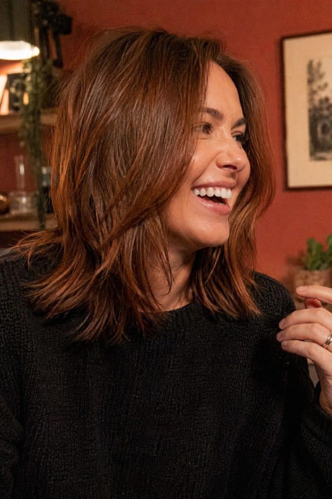 Cinnamon spice brunette fall hair color with red-gold glow